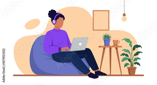 Young woman comfortably working or studying from home, wearing headphones and using a laptop on a beanbag chair. Represents remote work, online learning, and relaxed productivity.