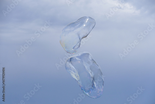 Huge bubble with blue sky and white cloud background
