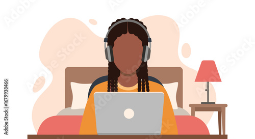 Young woman with braids and headphones working or studying on a laptop in bed. Represents remote work, online learning, or digital lifestyle, emphasizing comfort and focus.