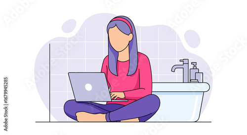young woman working from home on laptop in the bathroom