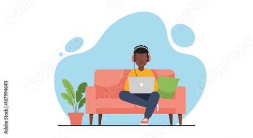 Young person using a laptop and headphones while relaxing on a couch at home. Ideal for concepts of remote work, online learning, or leisure.