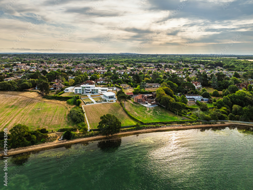 Fototapeta premium River Hamble over Warsash Maritime Academy Pier from drone, Hamble-le-Rice, Warsash, Southampton Water, Hampshire, England