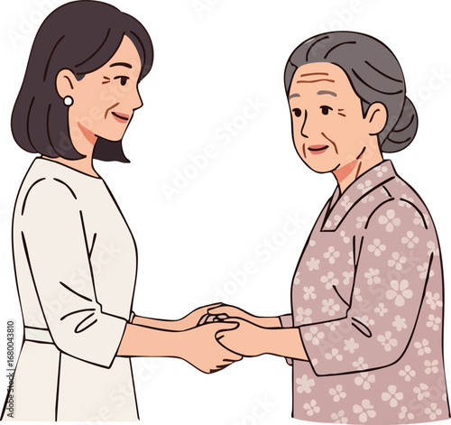 Caring young woman holding her elderly mothers hands.