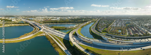American big freeway intersection in Miami, Florida with fast moving cars and trucks. USA transportation infrastructure concept