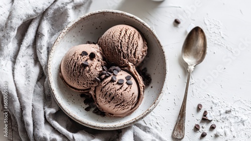 Flat Lay of Chocolate Ice Cream Scoops with Spoon and Cocoa Nibs