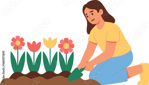 Woman planting flowers in a garden