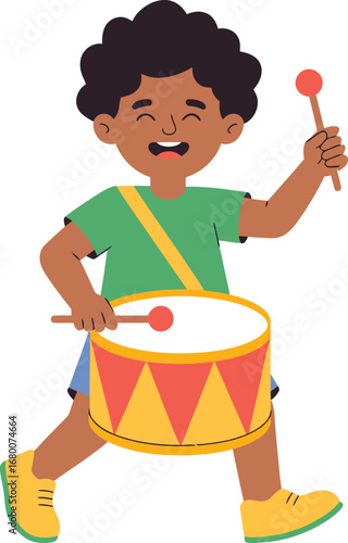 Happy boy playing drum with drumsticks