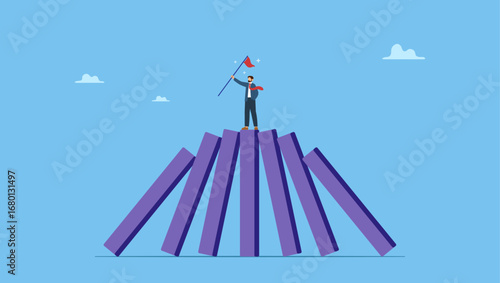 Success businessman on stand strong bar graph domino collapse. Winner take all, survive business competition or strength to overcome difficulty, economic crisis or recession, business winner.