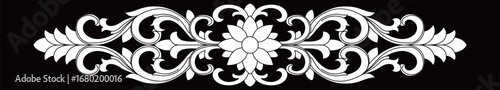 A classic beautiful symmetrical ornamental design features a central flower and flowing scrolls.