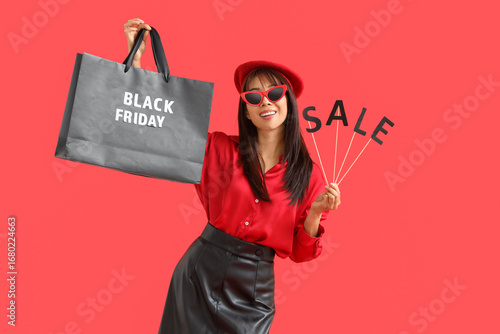 Stylish young Asian woman w...