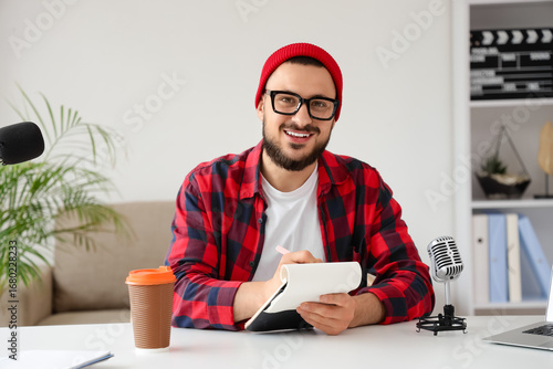 Handsome man with notebook ...