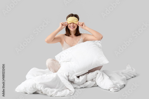 Young woman in sleeping mas...