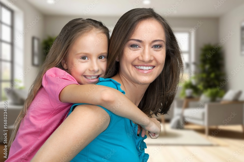 © BillionPhotos.com - Lovely child daughter embracing young mom