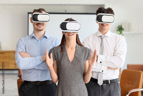 Young business people using...