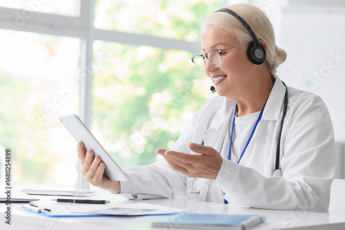 Female doctor with headset ...