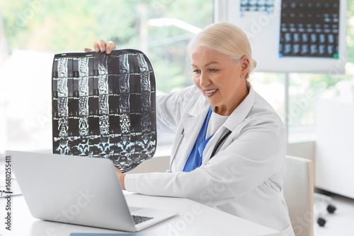 Female doctor with MRI scan...