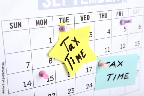 Papers with text TAX TIME o...