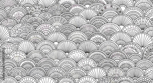 Detailed View of a Textured Surface with Repeating Fan Shaped Patterns and Scattered Light Spots