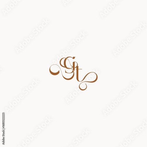 caligraphic style monogram luxury minimalist logo design TG wedding initial concept letter