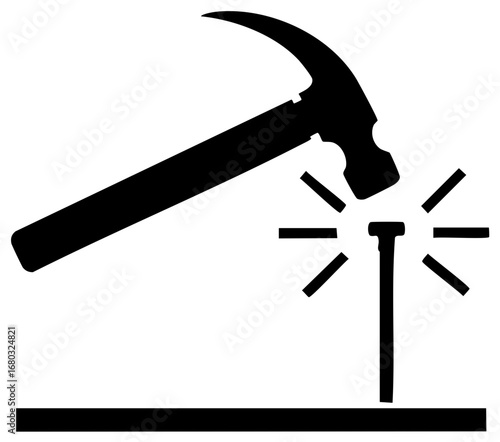 Hammer hitting nail into wooden board with sparks