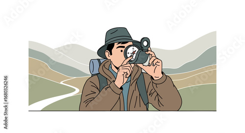 Adventurous traveler using a compass to navigate the mountainous landscape and exploring