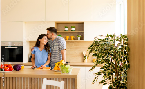 Couple cooks together in a ...