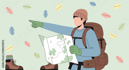 Adventurous Hiker Following Trail Map to Explore Nature's Beautiful Landscape