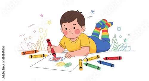 Adorable child drawing happily with crayons on a plain white paper and smiling