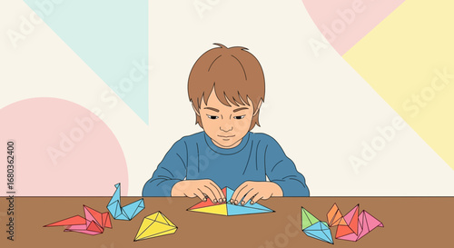 A young boy making origami shapes with paper creating art at the table