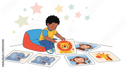 A young boy playing with animal cards while sitting on a beanbag chair
