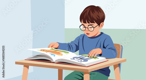 A young boy with glasses reading a colorful book at a wooden desk diligently