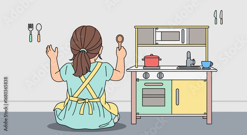 A Young Girl Playing with a Toy Kitchen, Imagining the Fun of Cooking