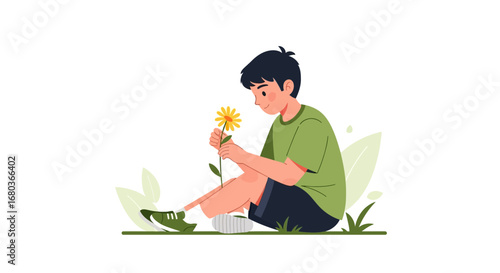 A Young Man Sits on the Grass, Smelling a Flower, in a Nature Setting