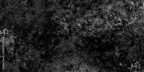 Abstract black grunge texture with dust grain and scratch patterns, dark concrete surface effect, distressed overlay background for vintage and cinematic style.