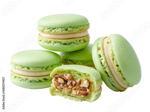 Delightful Pistachio Macarons A tempting assortment of pastel green cookies with creamy filling, some featuring crunchy nuts