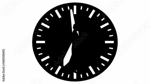 Black analog clock face showing approximately five minutes after twelve o clock with white background silhouette