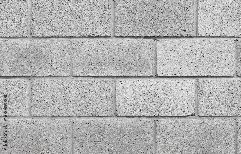 Light gray rectangular concrete blocks forming a wall Light gray rectangular concrete blocks forming a wall