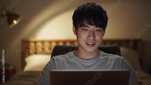 Happy Man Working on Laptop at Night