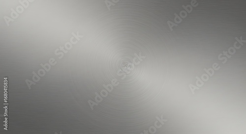 A sleek, gray brushed metal texture with a circular, radiating pattern, perfect for a modern background.

