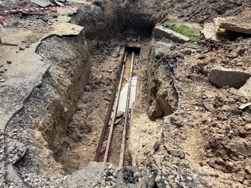 deep trench old leaky working water pipe. repair and replacement of city and underground utilities.