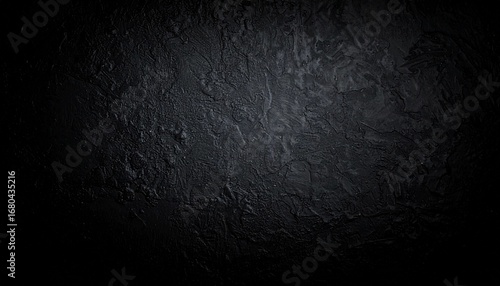 黒い壁のテクスチャ　光と影で浮かび上がるシンプルな背景　微妙な凹凸