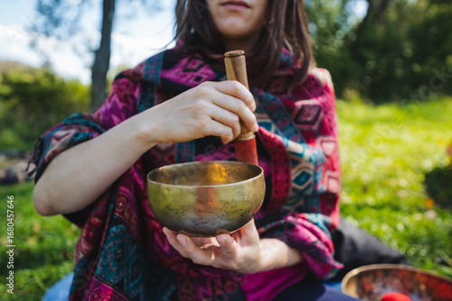 Experience the calming effects of sound healing with a singing bowl in nature, promoting relaxation, mindfulness, holistic wellness, and fostering deep peace and overall serenity in your life