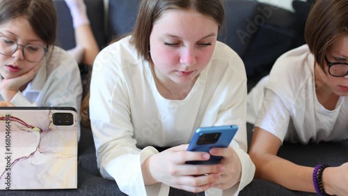 a group of teenagers immerse themselves in the world of selfies and social media