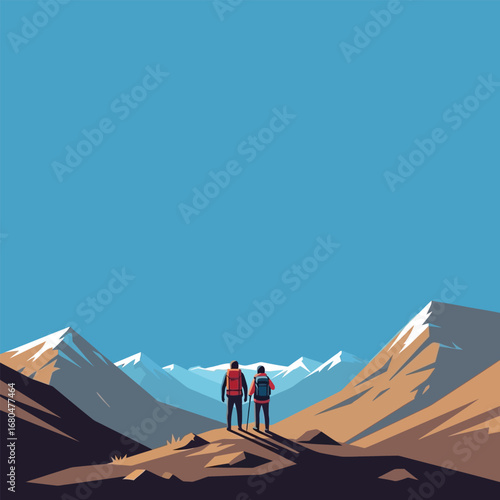 Two hikers stand on a mountain peak, gazing at a snow-capped mountain range under a clear blue sky.