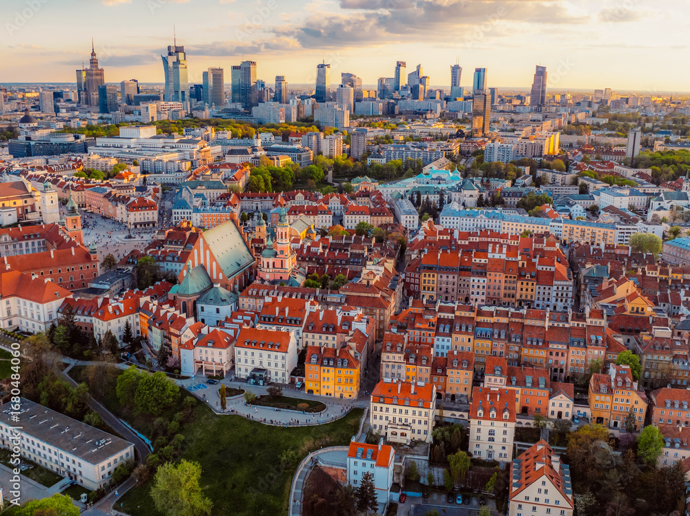 Fototapeta premium Warsaw old city center and skyscrapers in the background Vistula river. Sunset in Warsaw city center aerial view.