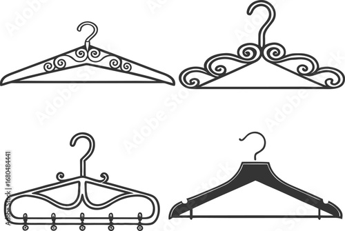 Four black clothing hangers with decorative elements