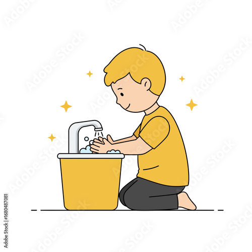 A young boy with blonde hair washes his hands at a sink, kneeling on the floor.