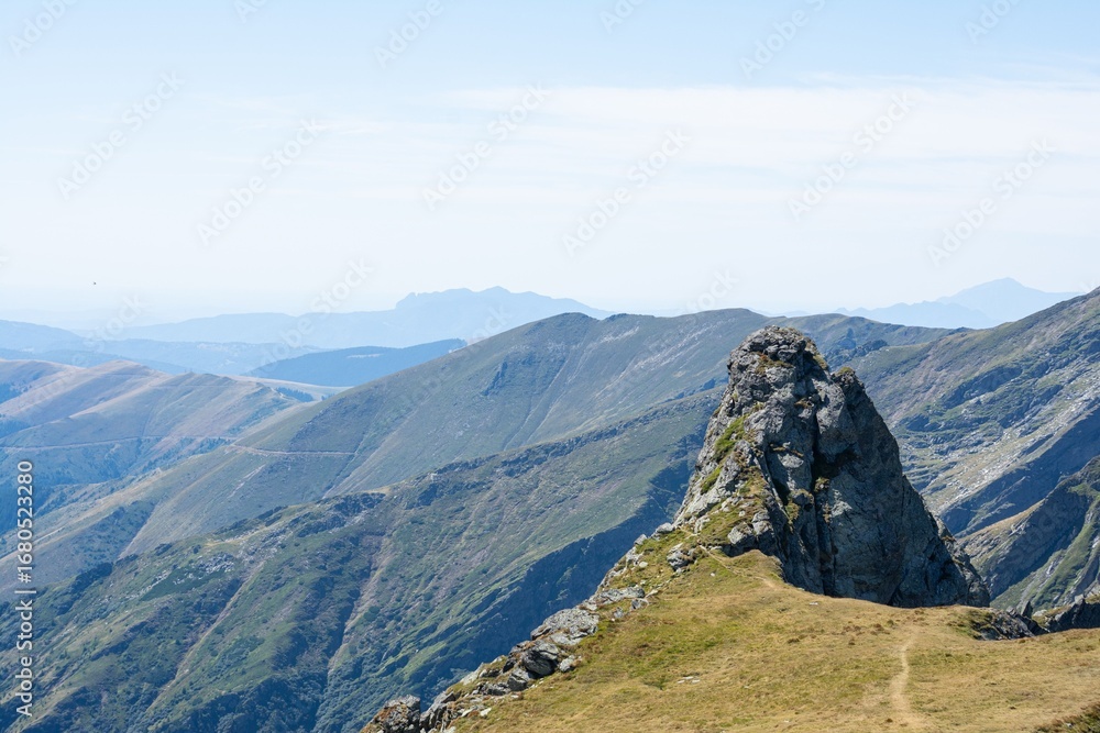 Fototapeta premium Majestic mountain range under clear sky