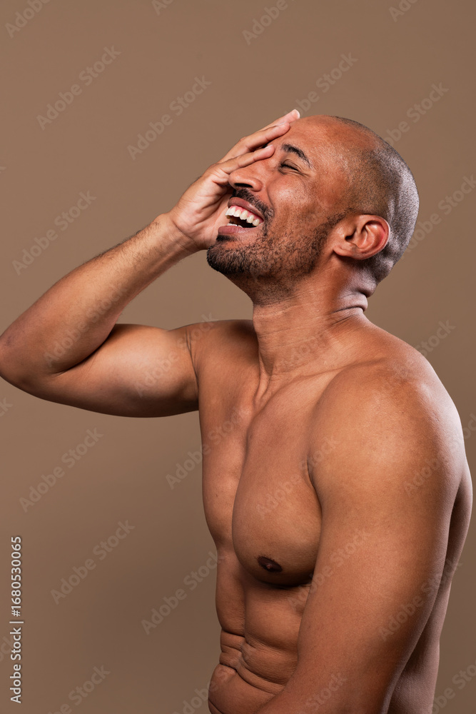 Fototapeta premium Beauty portrait of middle-aged hispanic black handsome man on colored background, concepts about beauty treatment, skincare and cosmetics for men