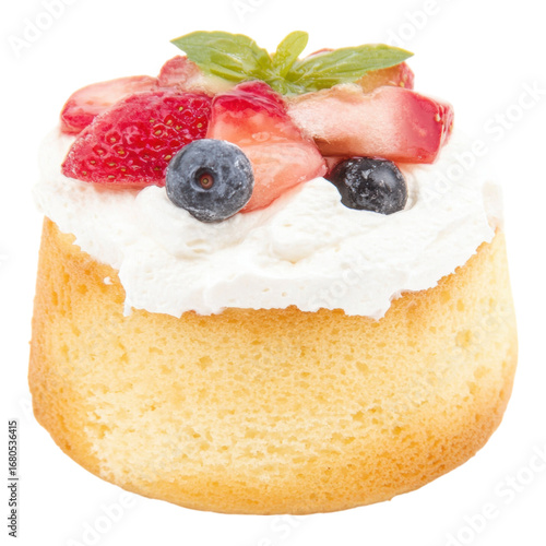 Light and airy chiffon cake topped with whipped cream, fresh strawberry, blueberry, and mint, creating delightful and inviting dessert presentation